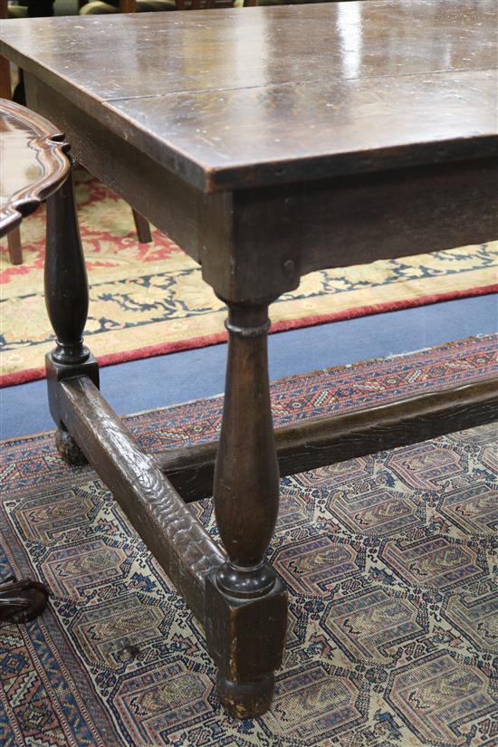 An 18th century style oak refectory table, W.196cm, D.86cm